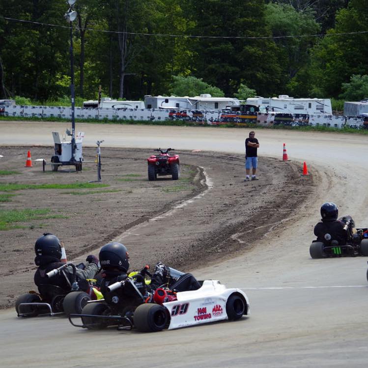 Kart #39 racing on dirt track with H&N Towing and MAC Tools sponsors